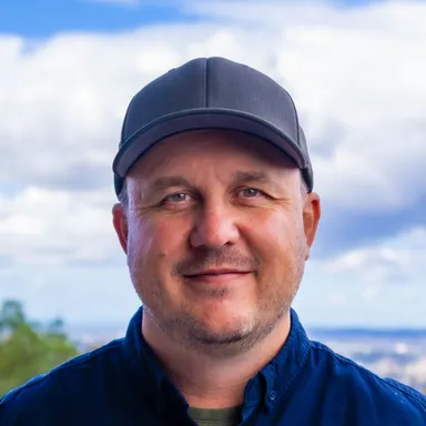 Gert Jansen van Rensburg - Profile photo outdoors wearing a cap